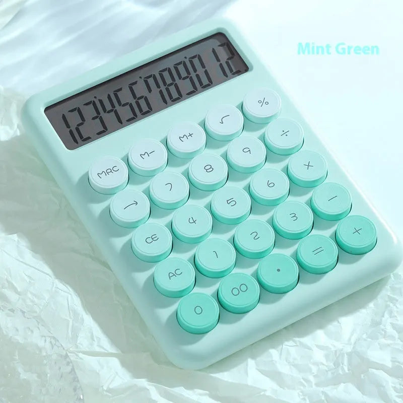 Dopamine gradient colour desk calculator in violet, pink, blue, and mint green on a desk.