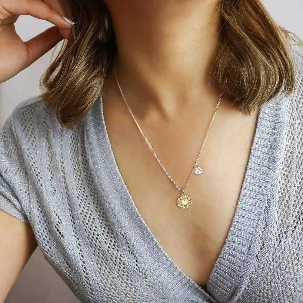 Sunflower pendant necklace in 925 silver on adjustable chain showing geometric petal details