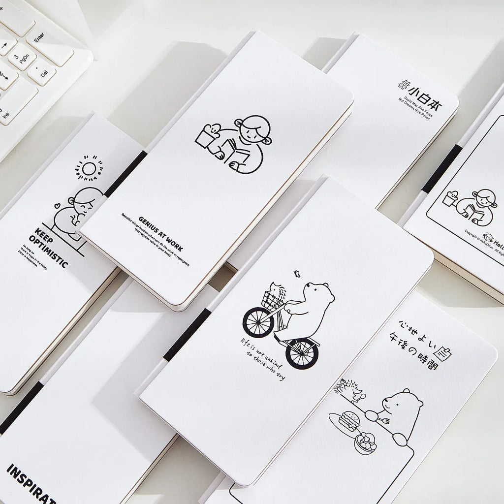 Small white paper notebook with plaid interior and simple cute style, includes stickers.