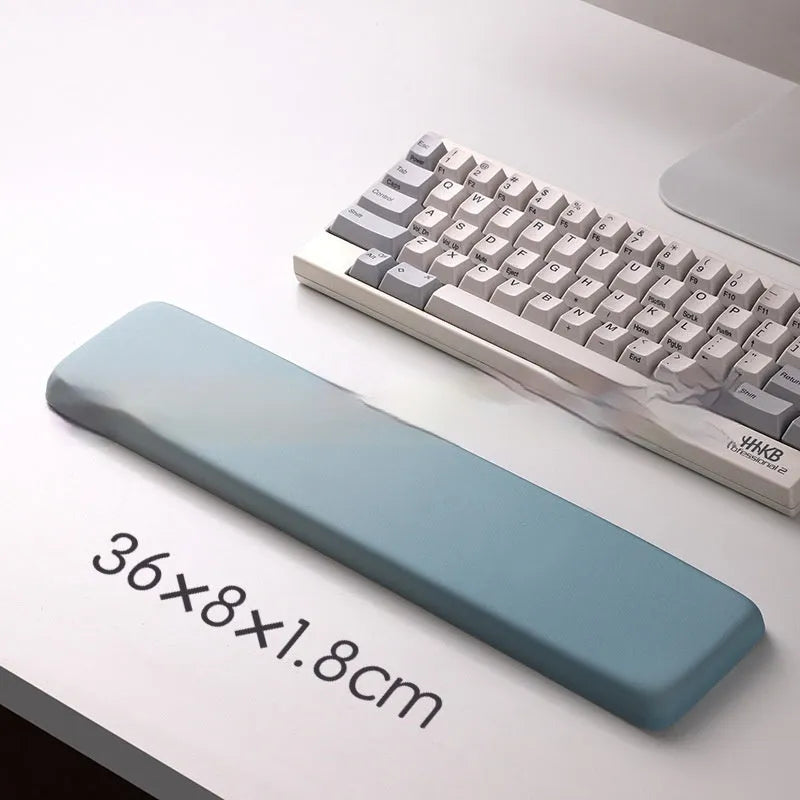 Square black silica gel wrist rest mouse pad with cloth surface on a desk.