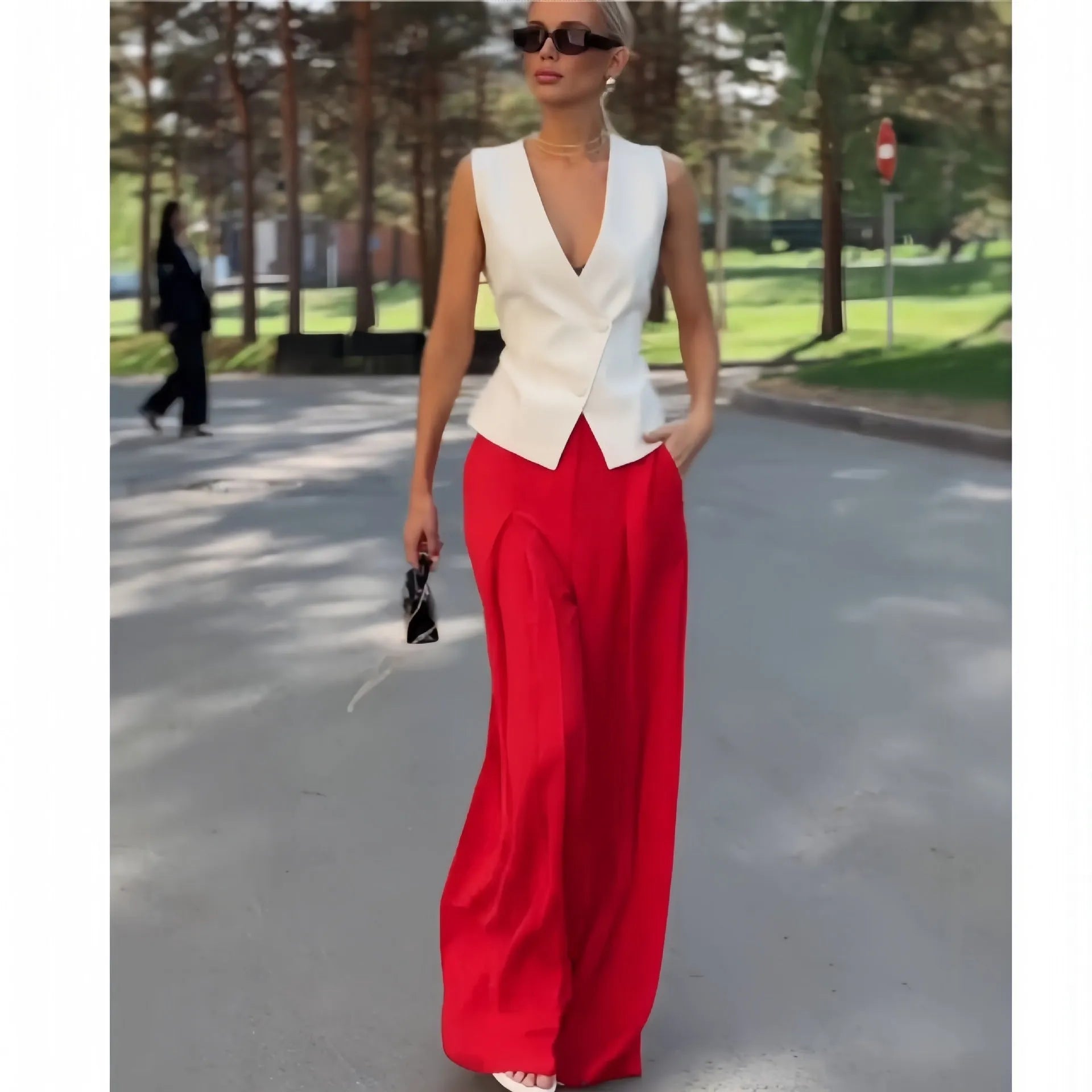 Women's beige polyester two-piece set with deep V-neck sleeveless top and high-waist wide-leg trousers