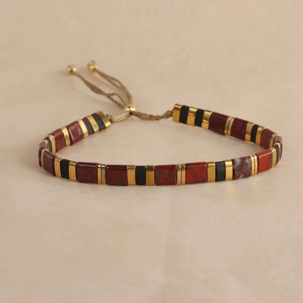 Geometric glass pull bead bracelet in five colour options on wrist