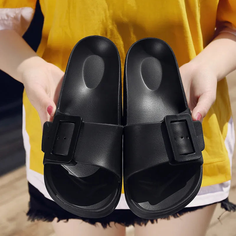 Women's grey blue flip flop slippers with a buckle strap and soft EVA sole.