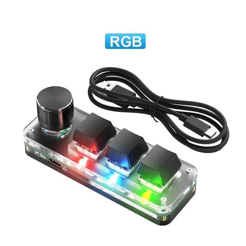 Black RGB backlit mini keyboard with copy and paste keys on desk