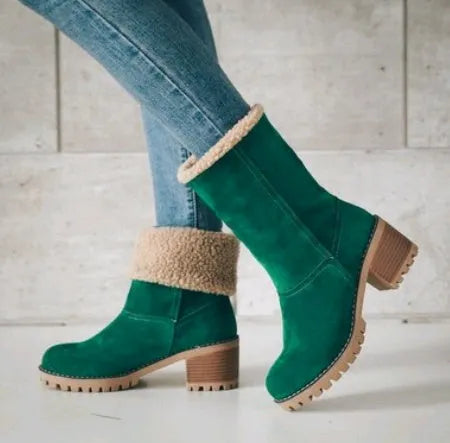 Women's black suede mid-tube knight snow boots with a thick sole and low flat heel on a plain background.