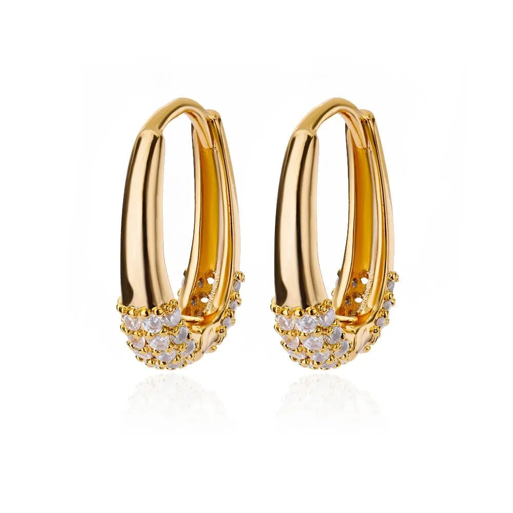 Geometric butterfly-shaped earrings with heart, bow, and star details in copper with a diamond-cut finish.