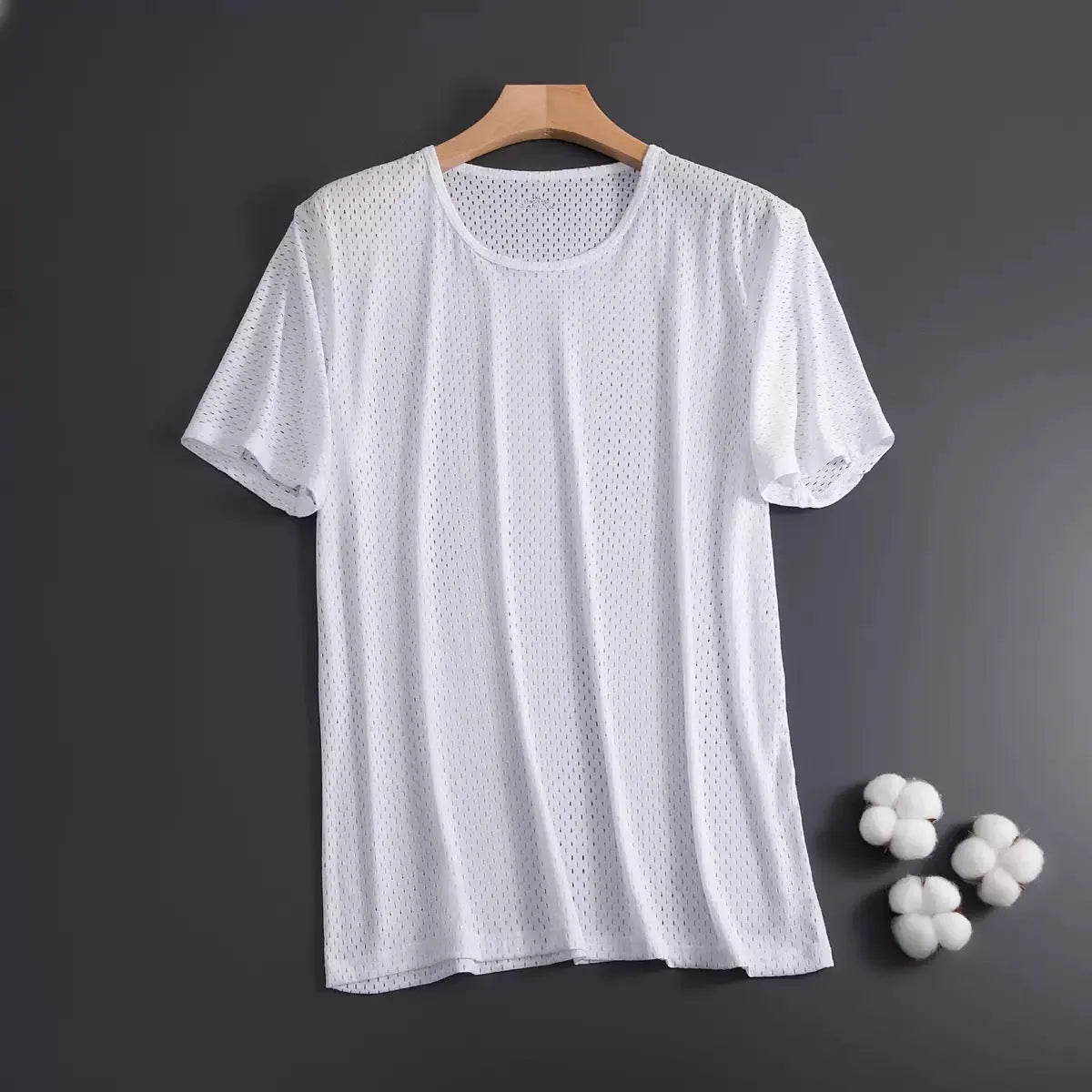 Man wearing a loose-fit ice silk short sleeve T-shirt in a solid colour.