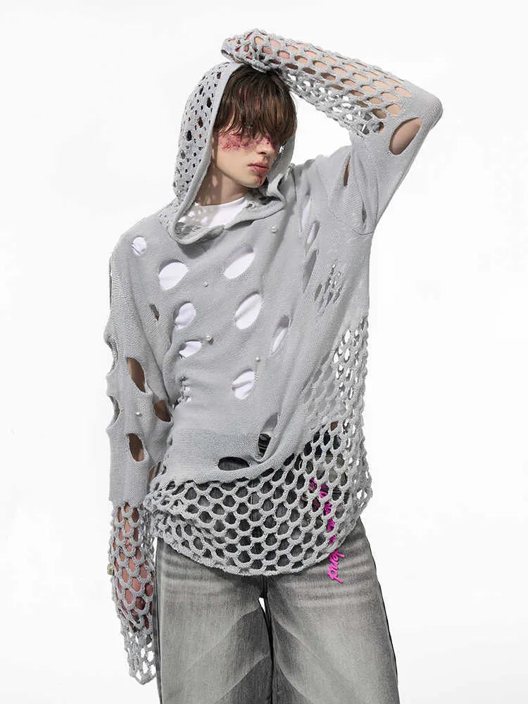 Black men's loose fit hoodie with pearl decorations on the hood, showing thin hollow knit construction.