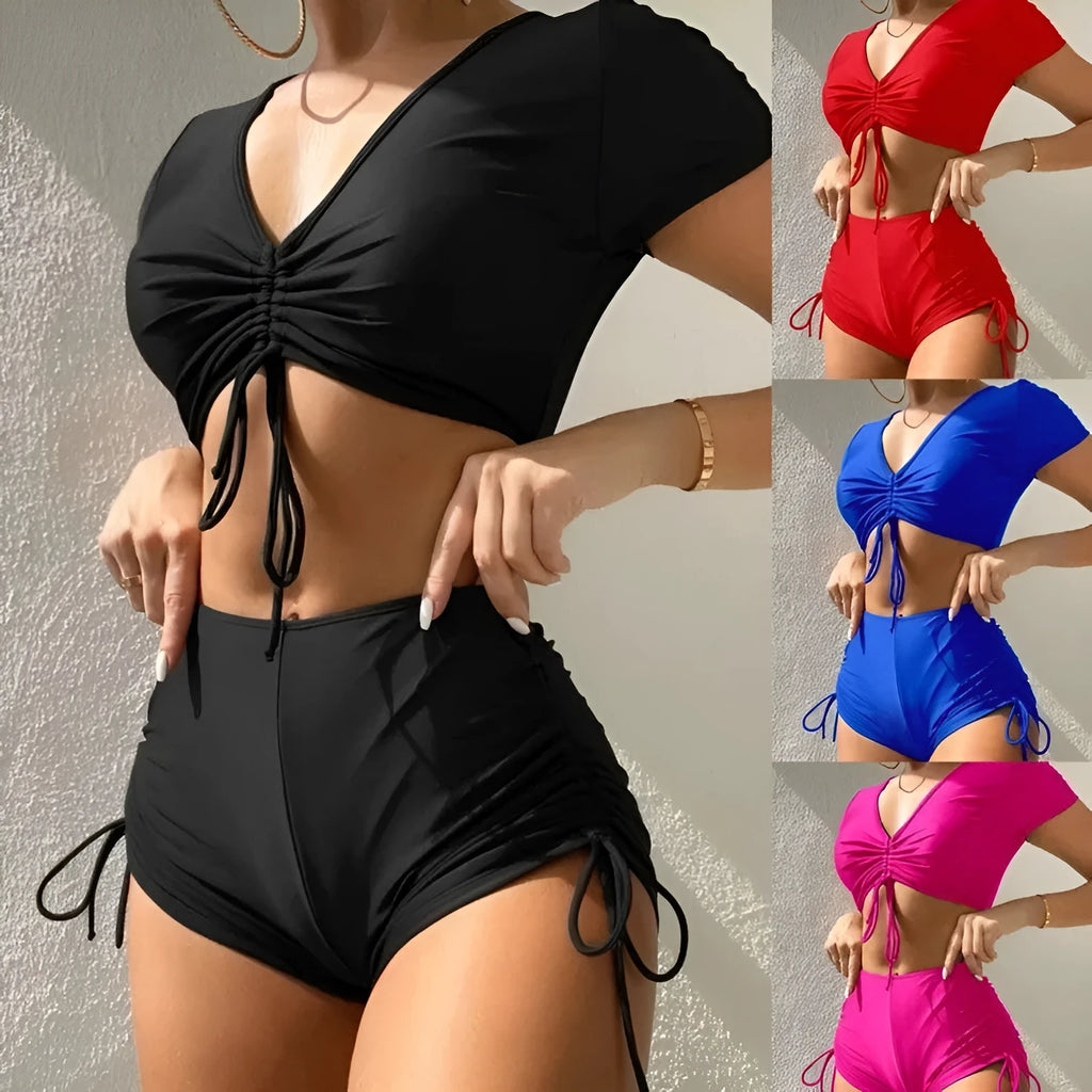 Lady's dark green two-piece bikini with lace-up front and bow detail on the top.
