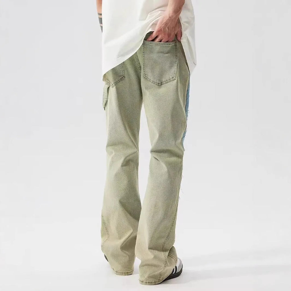 Retro yellow and blue patchwork jeans with splash-ink damaged design on polyester denim fabric