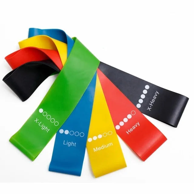 Five colour-coded TPE yoga tension straps with graduated thickness for resistance training
