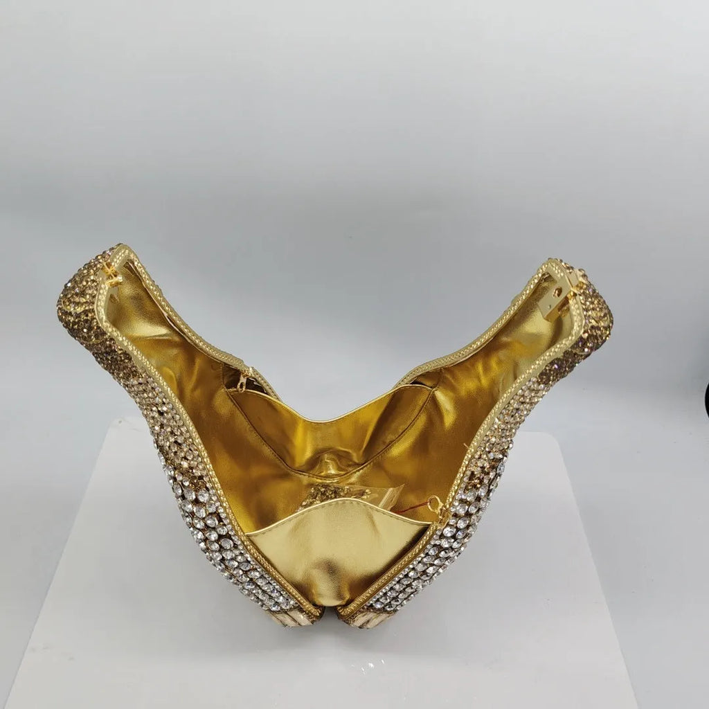 Champagne bottle shaped evening clutch with rhinestone details and metallic finish
