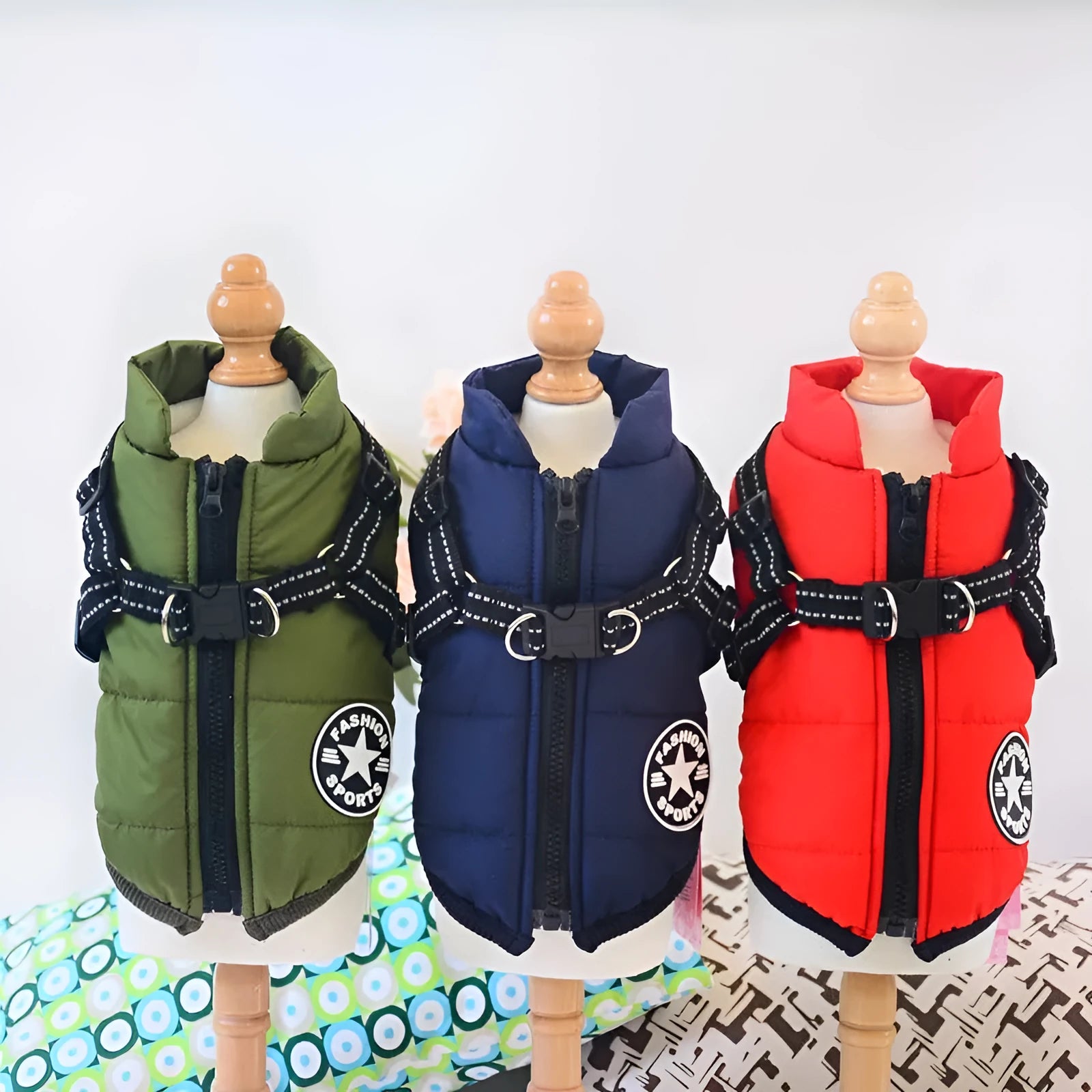 Waterproof dog coat with integrated harness in rain silk fabric available in red, navy blue, and army green colours