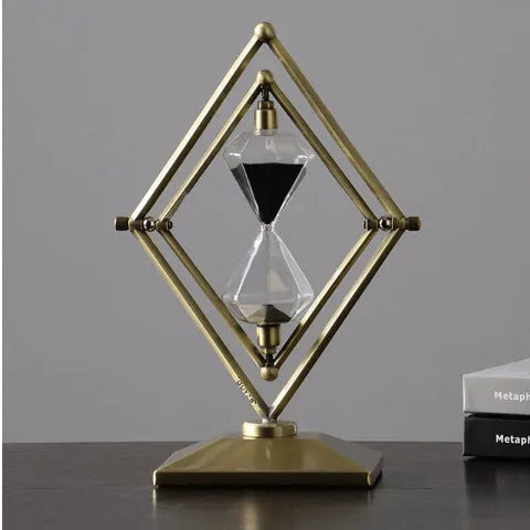 Glass sand timer ornament with zinc alloy metal base showing sand flow timing mechanism