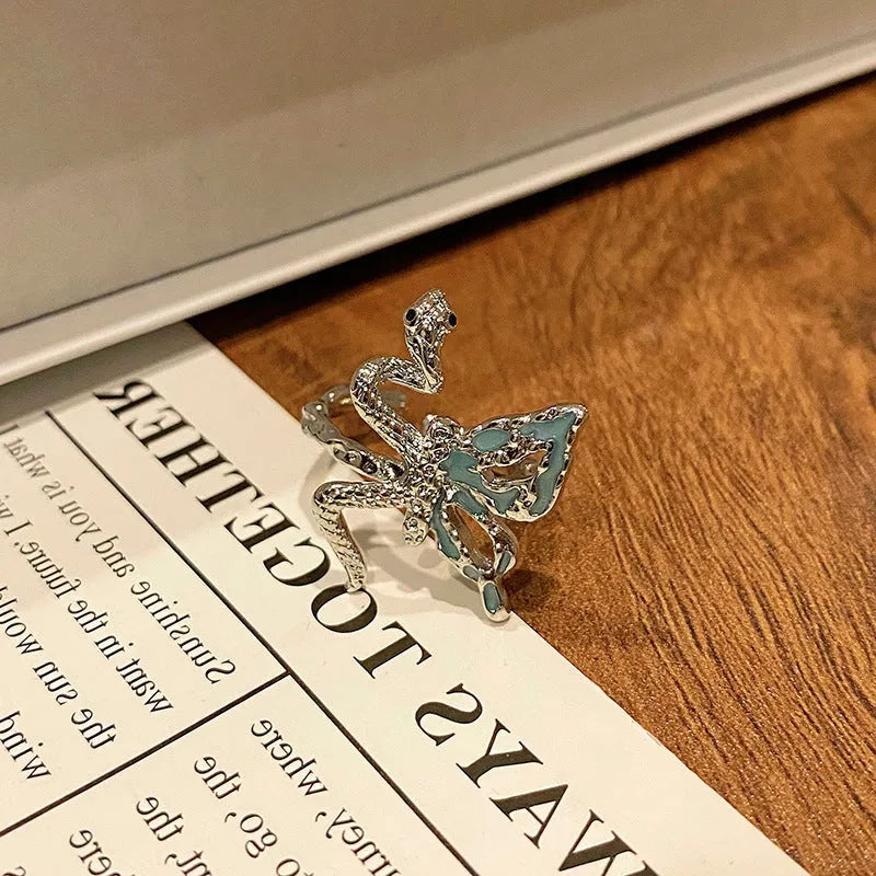 Women's copper butterfly ring with dripping oil finish and adjustable open loop design
