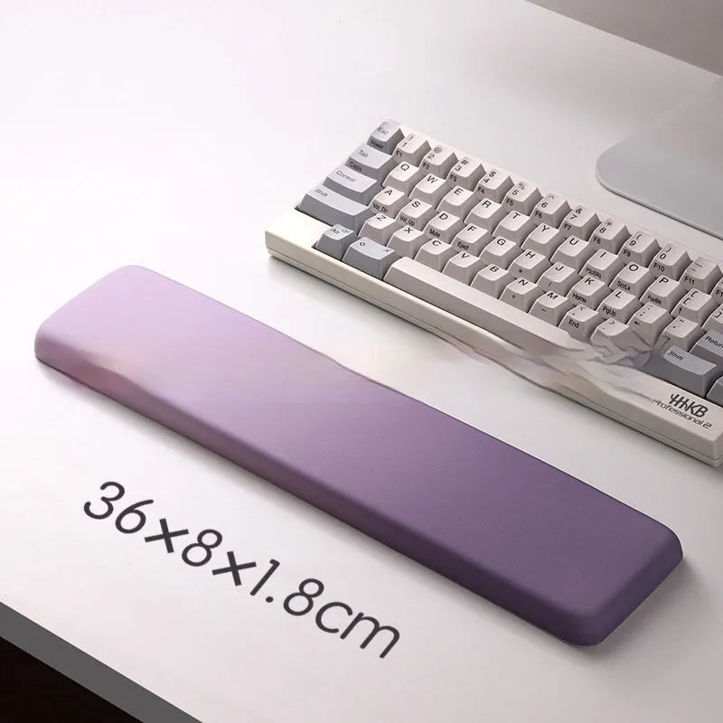 Square black silica gel wrist rest mouse pad with cloth surface on a desk.