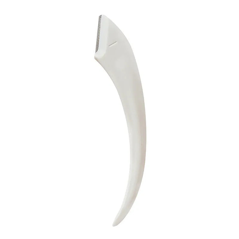 Close-up of a white and pink eyebrow trimming knife with a small curved plastic comb on a plain background.