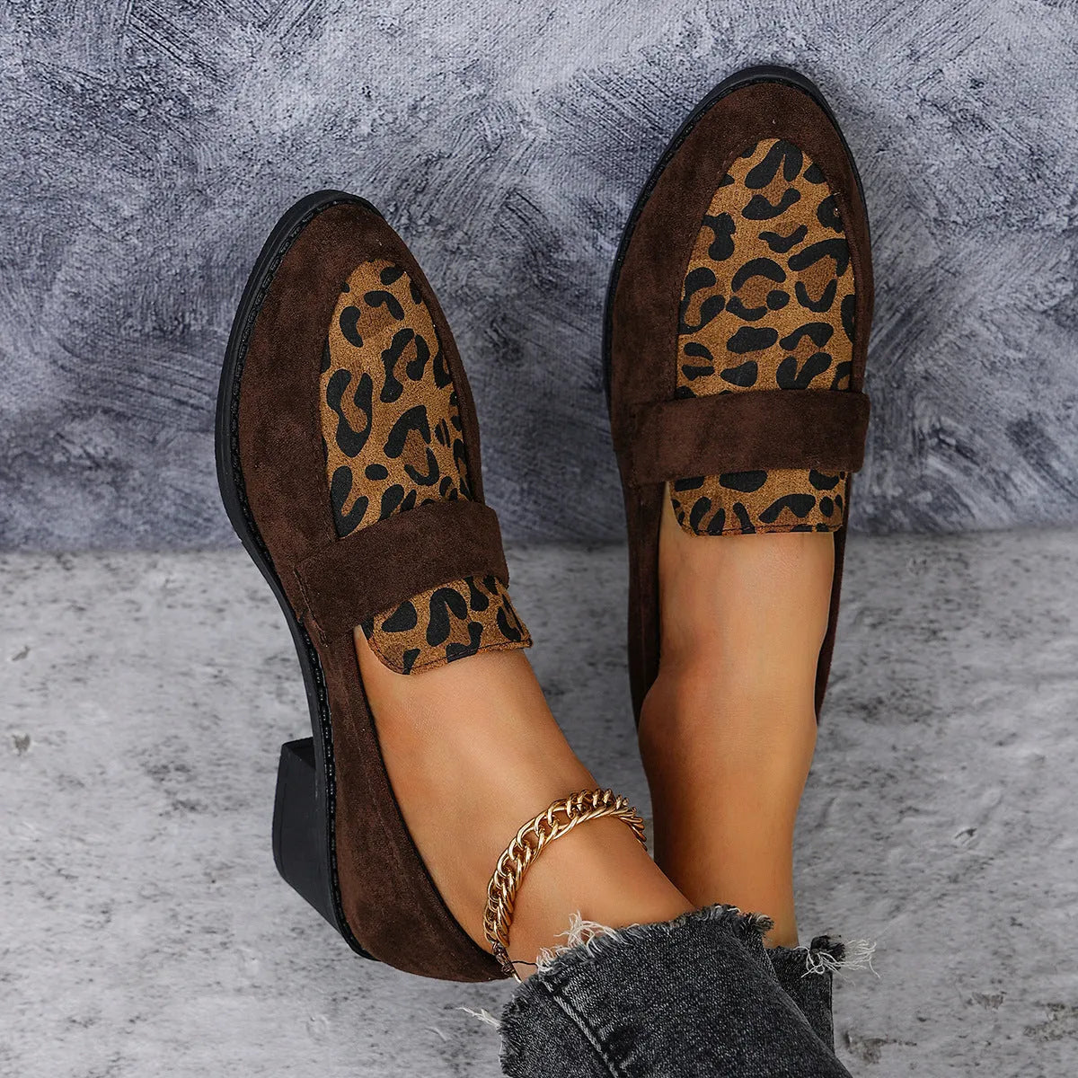 Leopard print slip-on suede shoes with chunky rubber sole and pointed toe design