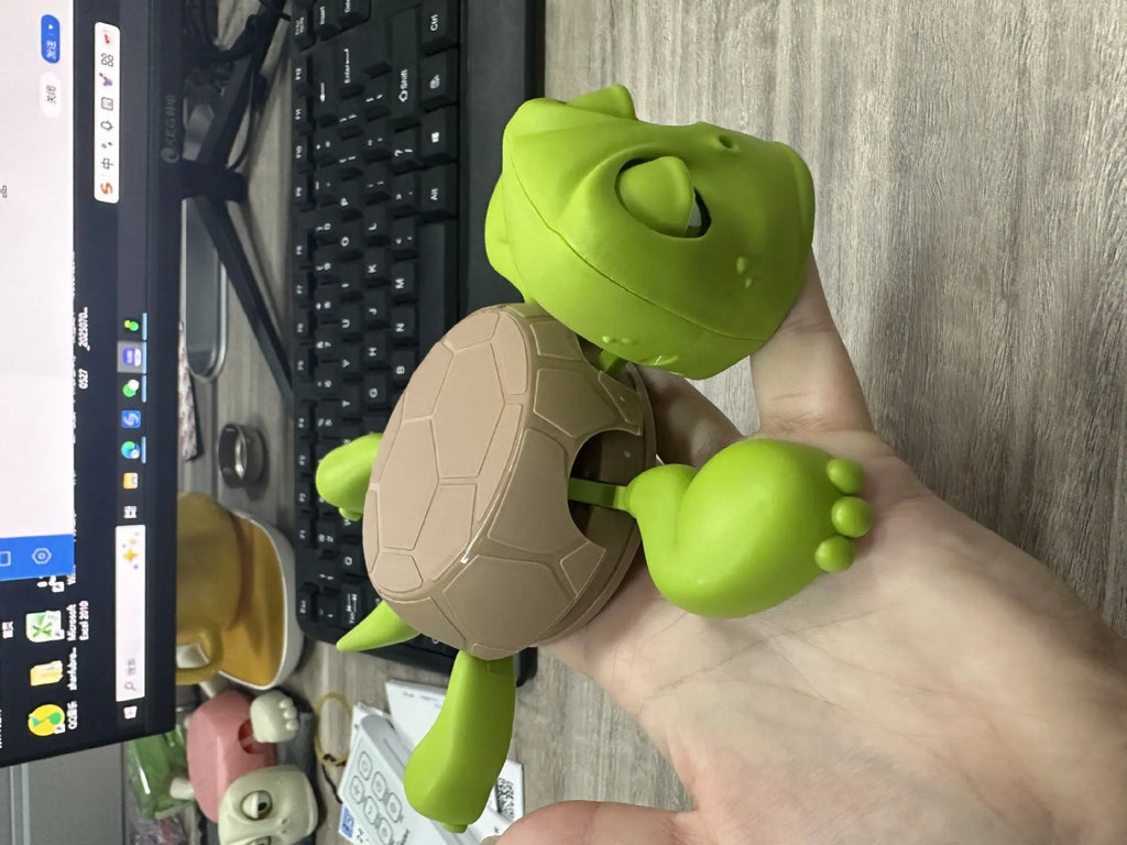 Turtle-shaped ABS coaster in light green colour with heat insulation properties