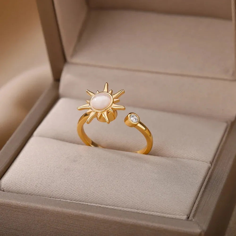 Adjustable copper ring with rotatable element in gold or platinum finish, simple geometric design
