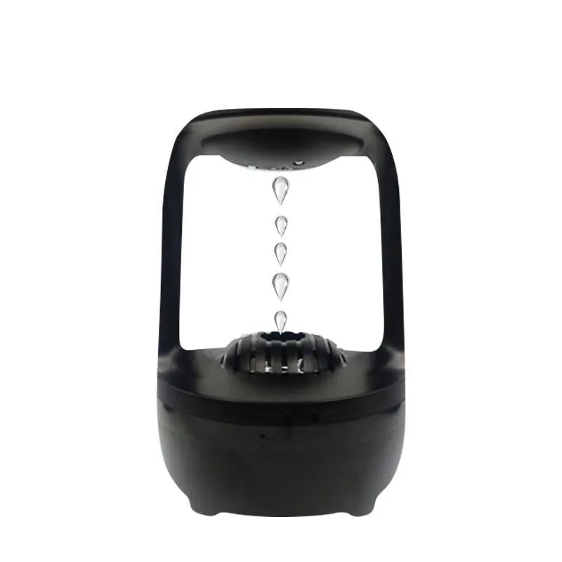 Black anti-gravity humidifier showing water droplet backflow effect with USB cable