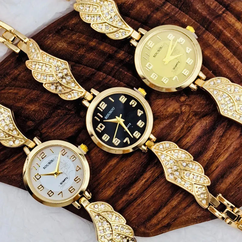 Stainless steel women's watch with round dial on wrist, showing gold surface finish option.