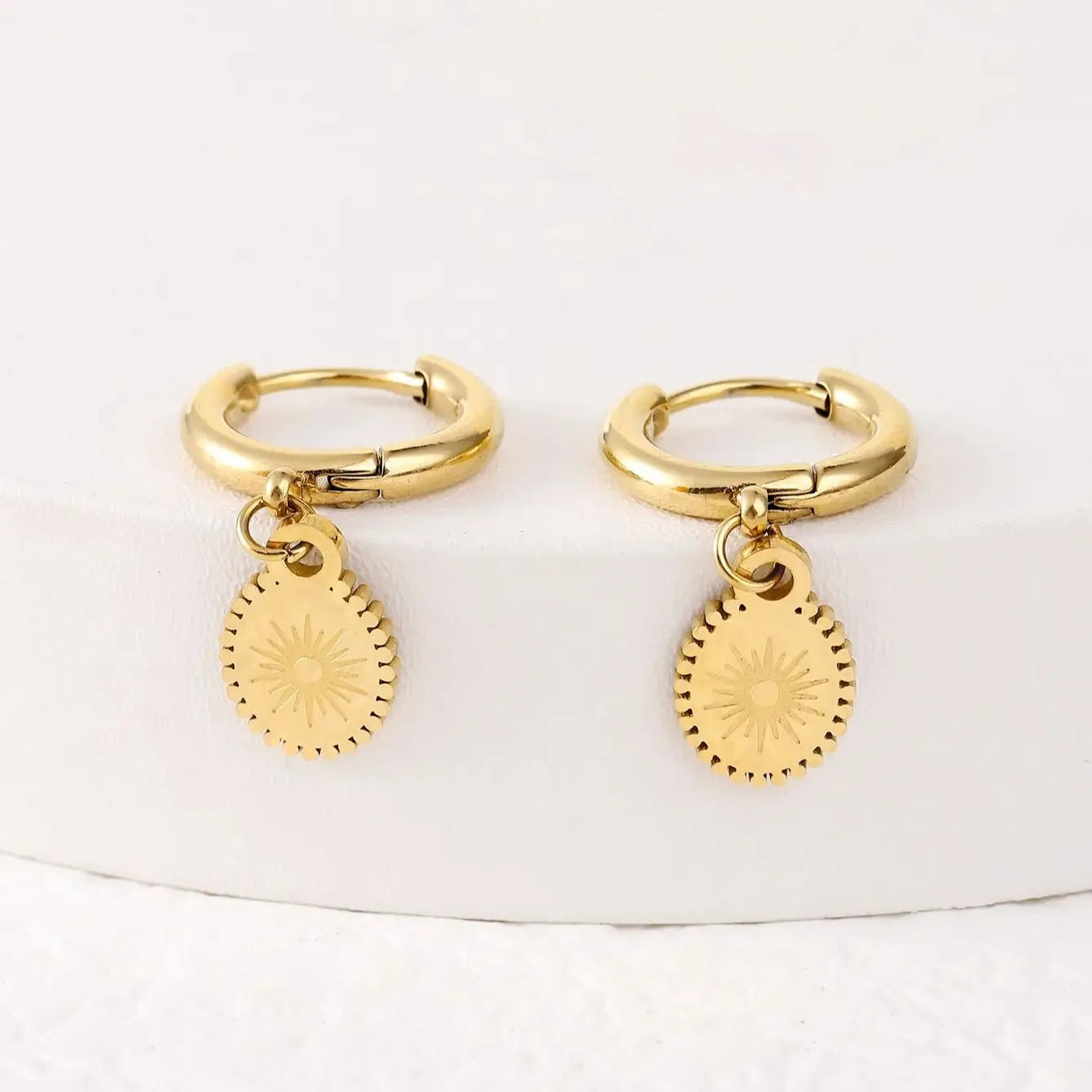 A pair of stainless steel geometric button earrings with ellipse detail, colour XY-EH005.