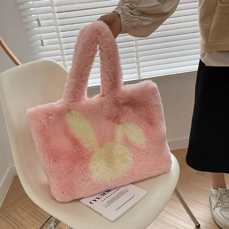 Plush shoulder bag with cartoon rabbit ears detail in solid colour