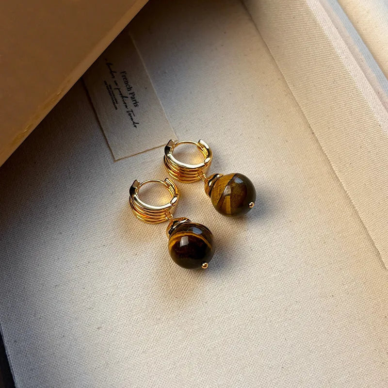 Gold-plated geometric earrings made from brown and black Tigereye stone in a French retro style.