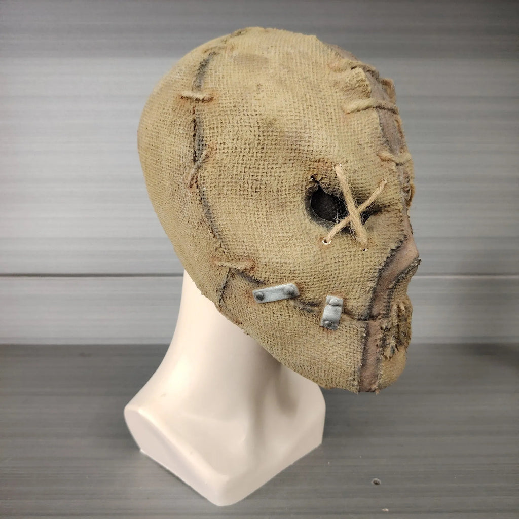 Latex Halloween horror mask showing detailed scarred skull modelling