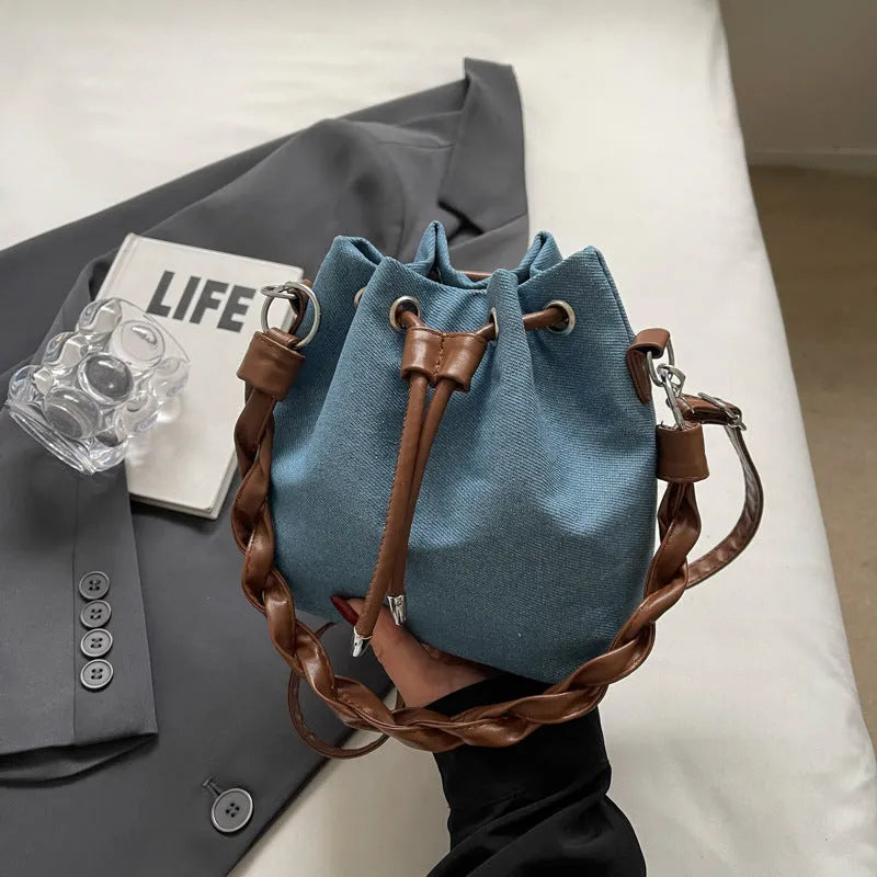 Blue synthetic leather cross body bucket messenger bag with sandwich pocket design
