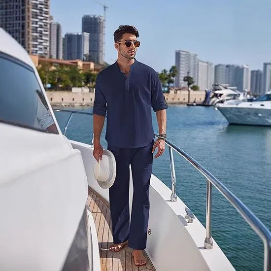 Men's casual cotton suit set in a solid colour, featuring a long-sleeved top and matching trousers.