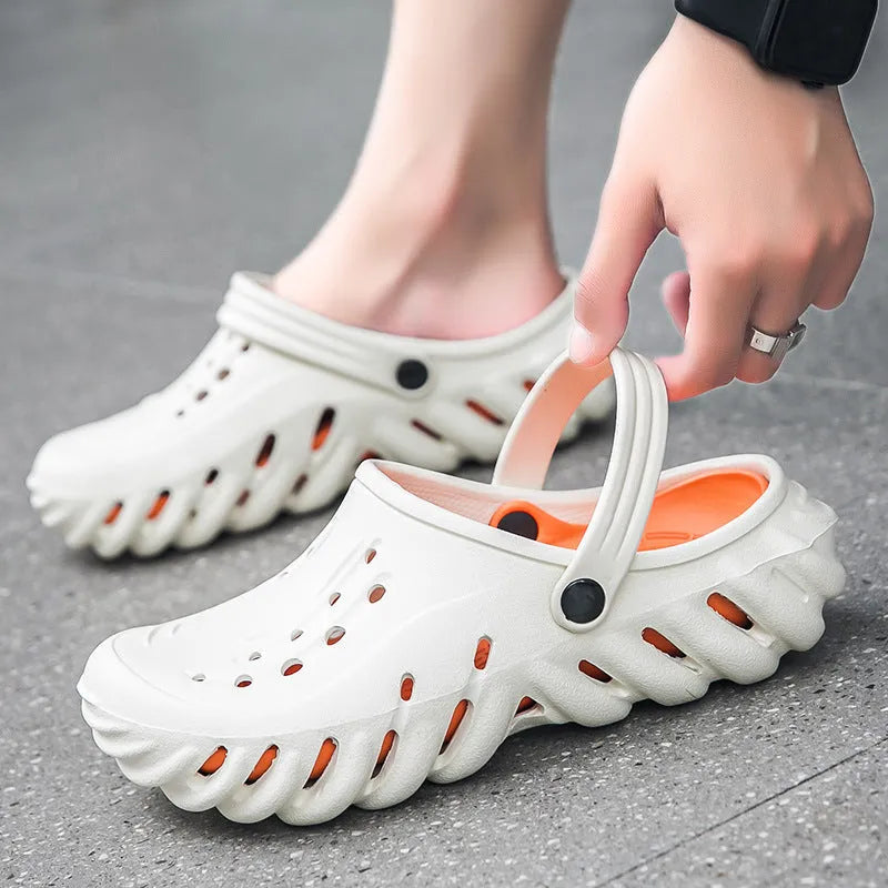 Men's beige hollow-out EVA slipper sandals with non-slip sole and round toe, shown on a white background.