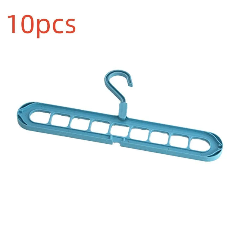 Green plastic nine-hole folding hanger for trousers displayed open and closed.