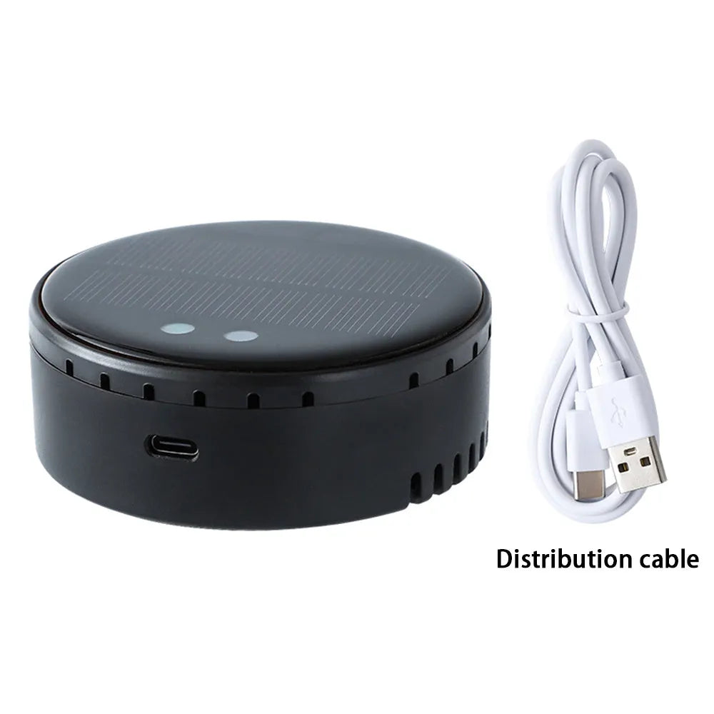 Black solar-powered car air humidifier mounted in a vehicle air conditioning vent