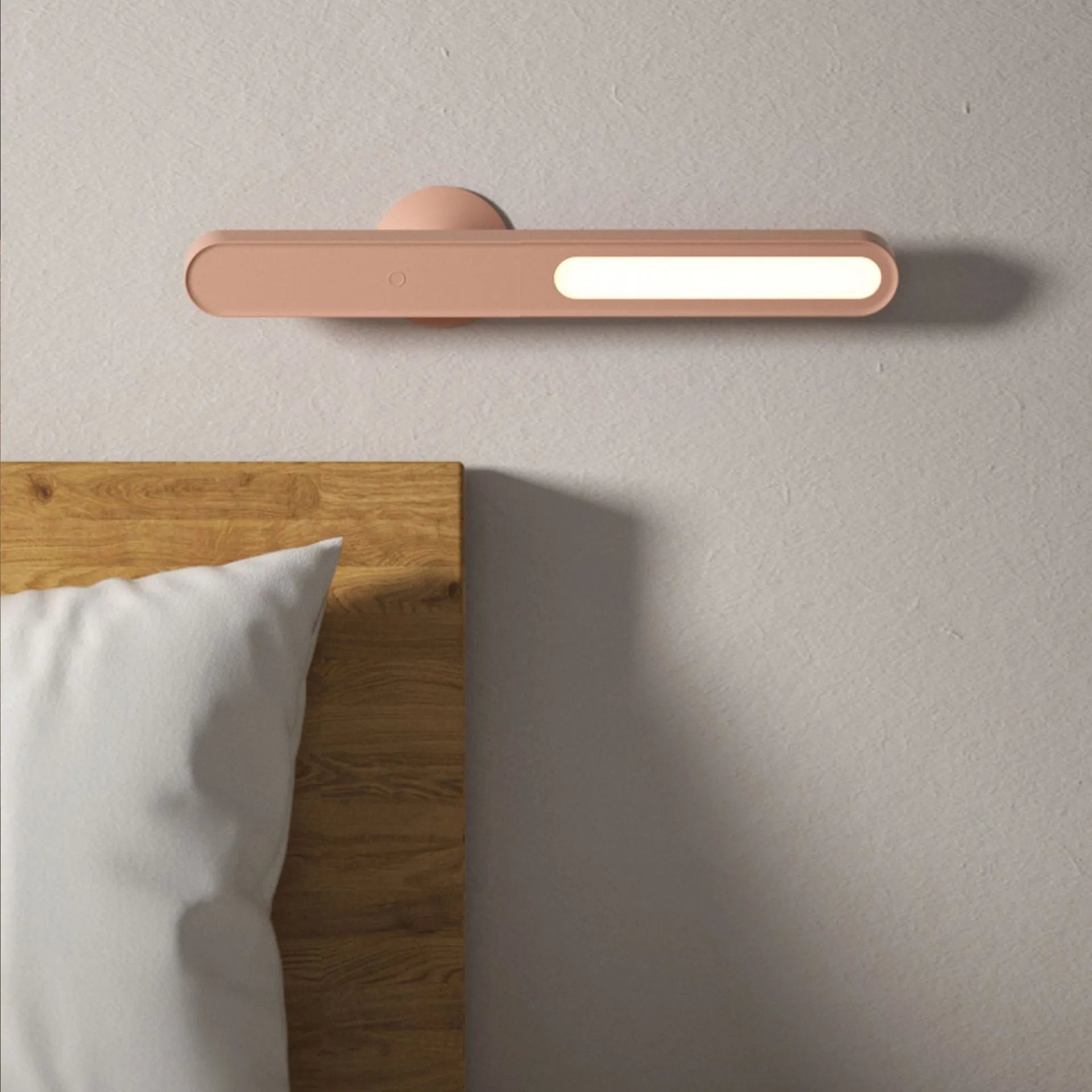 Geometric desk lamp with magnetic base shown attached to metal surface as wall light