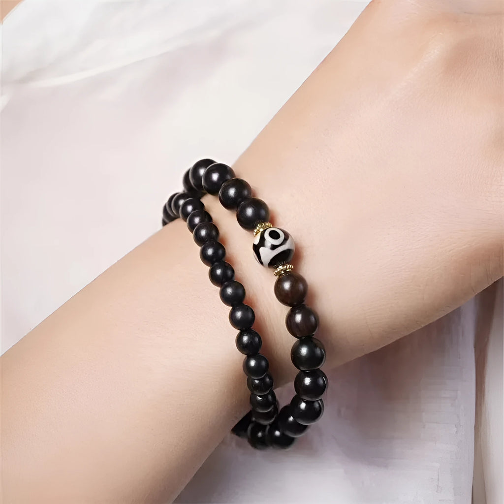 Ebony wood Tibetan bracelet with 8mm beads and two-circle pattern on wrist