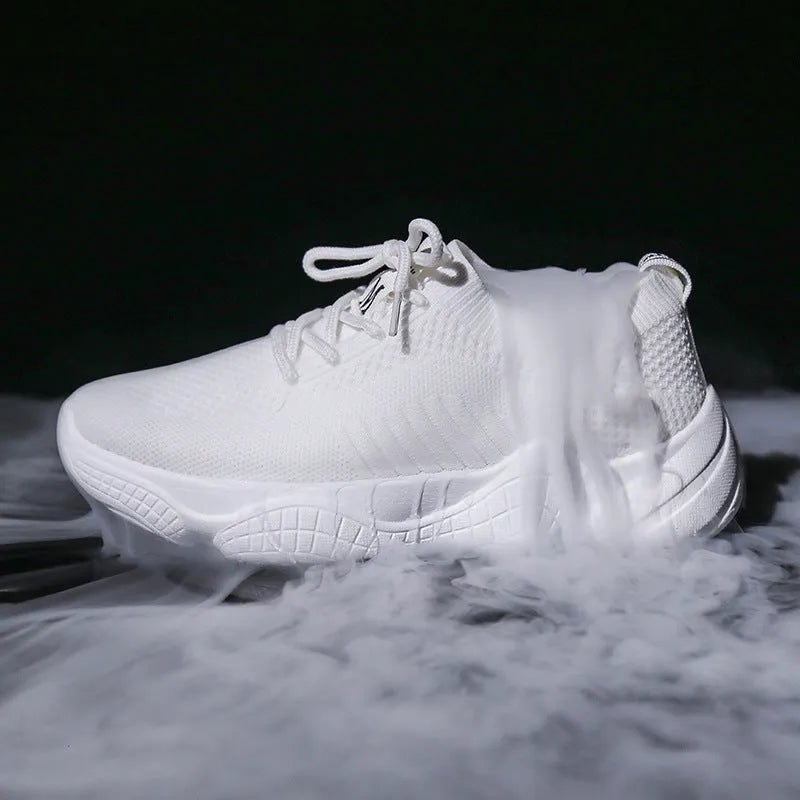 Women's white sports shoes with thick rubber soles and woven upper featuring lace-up front strap