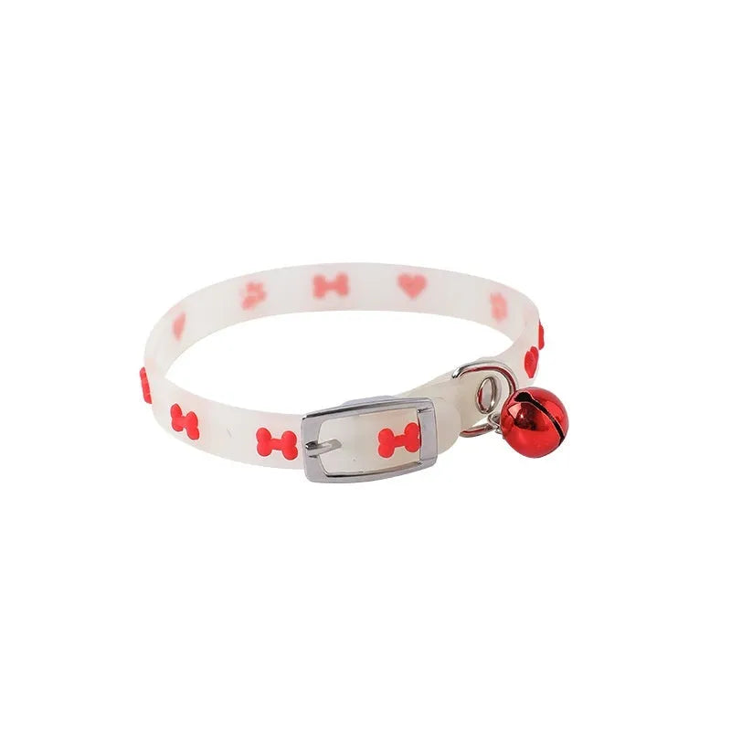 Luminous cat collar with adjustable silicone strap and metal bell in paw print pattern