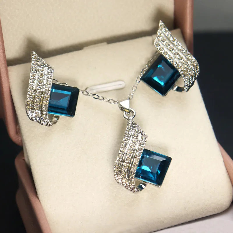 Alloy and glass necklace and earring set with cross chain design and electroplated finish