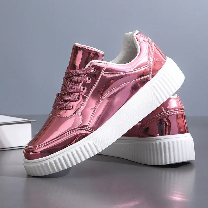 Rose gold sequinned platform sneakers with round toe and thick sole on a white background