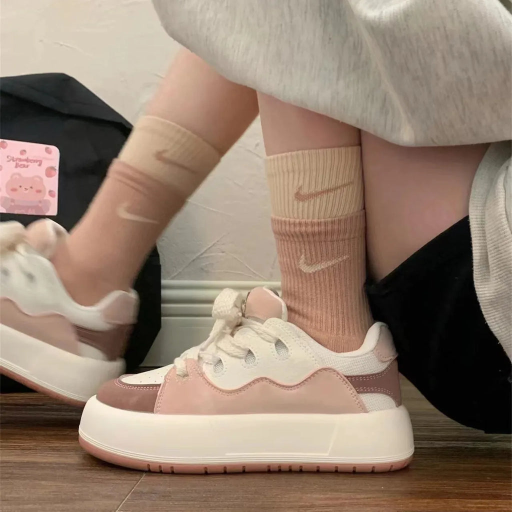 Green women's flat casual sneakers with a round toe and breathable PU mesh upper.