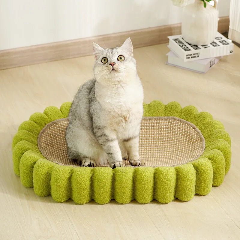 Green oval sisal cat scratcher bed measuring 650mm with scratching surface and lounging area