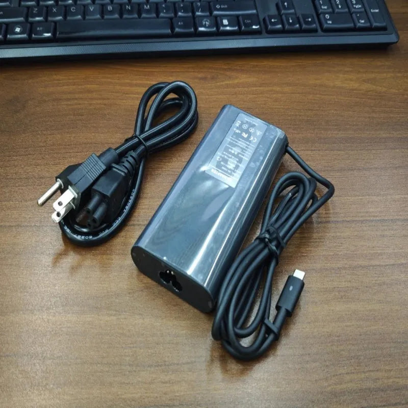 Black 65W USB Type-C laptop power adapter with international power cords