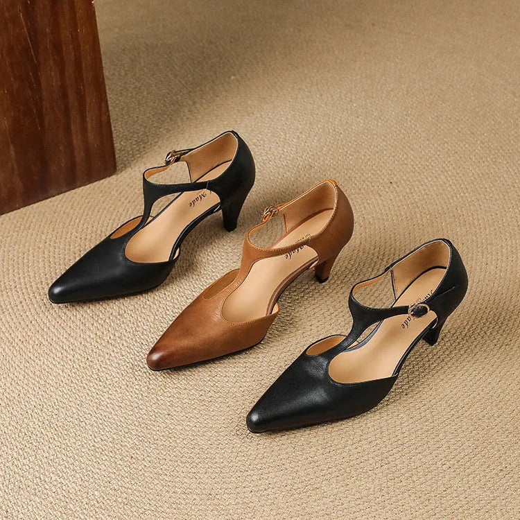 Brown women's retro sandals with a T-strap buckle and a short stout heel.