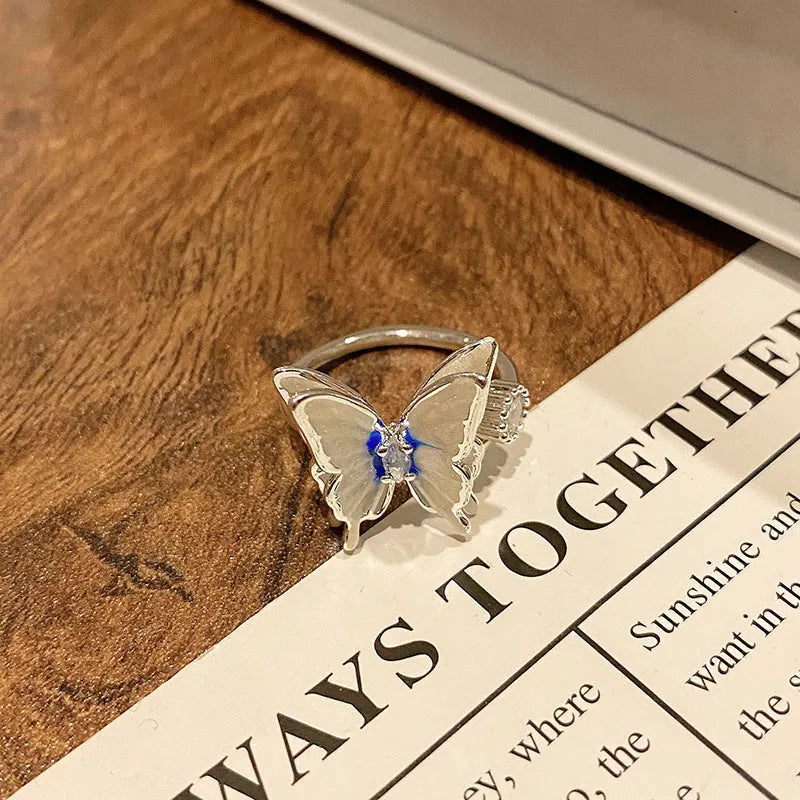 Women's copper butterfly ring with dripping oil finish and adjustable open loop design
