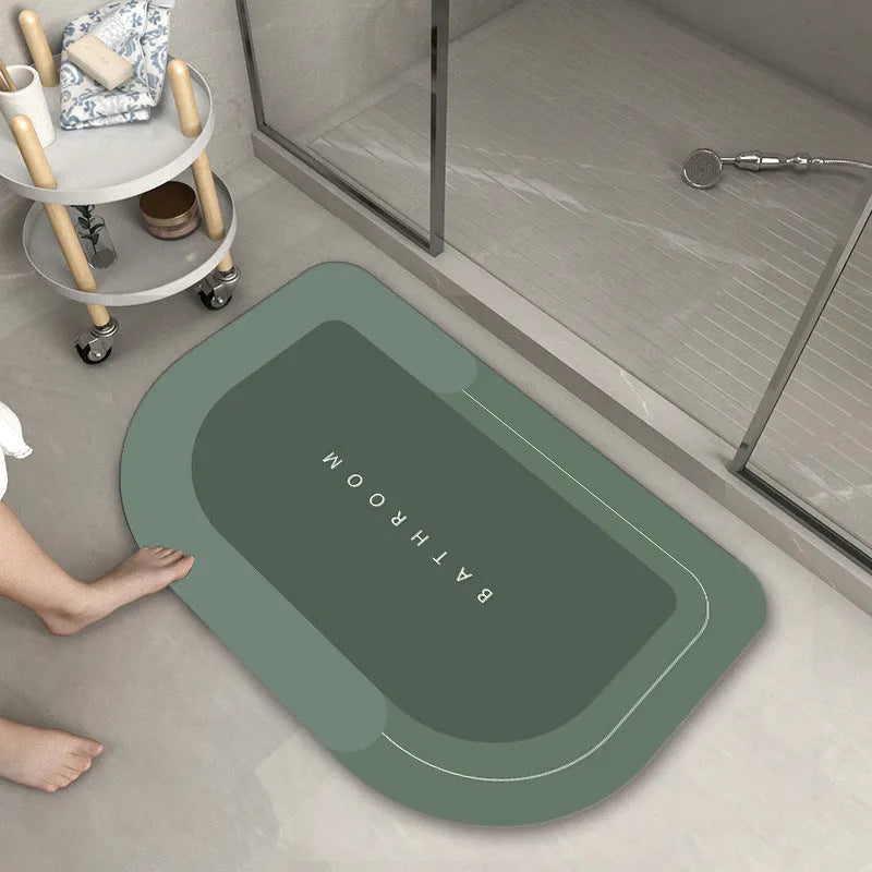 Blended fabric floor mat in an oval shape on a bathroom floor, available in multiple colours and sizes.