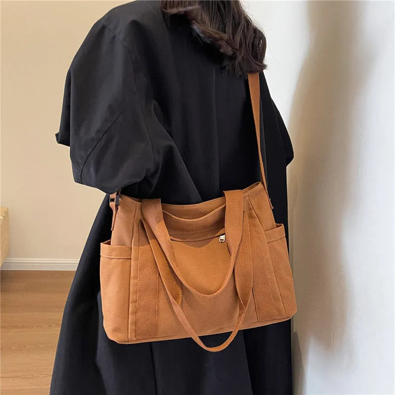 Women's canvas-style polyester shoulder bag with sandwich pocket and phone compartment in solid colour