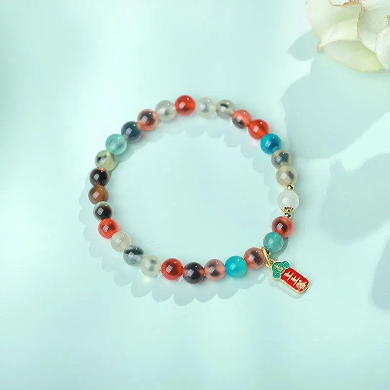 Natural agate women's bracelet with colourful sugar heart designs and geometric snake chain closure