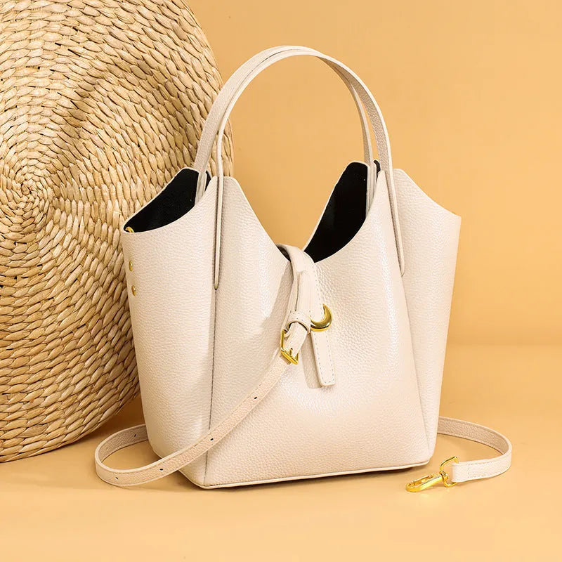 Genuine leather women's retro bucket handbag in beige colour showing sandwich pocket detail